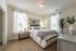 Cozy bedroom with a bed and two windows, modern apartment, luxury living, and spacious layout at Abberly Crest Apartments in Lexington Park, MD