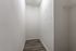 Storage area with white walls and a wooden floor at Abberly Crest Apartments in Lexington Park, MD