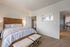 Cozy bedroom with a bed, modern apartment, luxury living, and spacious layout at Abberly Crest Apartments in Lexington Park, MD