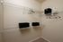 Walk-in closet with shoe racks and a pair of sneakers at Abberly Crest Apartments in Lexington Park, MD