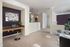 Spacious room with a desk nook and a glass table at Abberly Crest Apartments in Lexington Park, MD