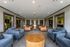 Lounge area with couches, chairs, and a coffee table at Abberly Crest Apartments in Lexington Park, MD