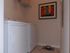 Washer and dryer in a room with a picture on the wall at Abberly Crest Apartments in Lexington Park, MD