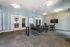 Conference room with a table, chairs, and a TV on the wall at Abberly Crest Apartments in Lexington Park, MD