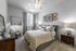 Cozy bedroom with a bed at Abberly Crest Apartments in Lexington Park, MD