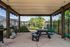 Shaded Patio Area with Grills at Abberly Crest in Lexington Park, MD