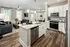 Kitchen with bar open to living room at Abberly Commons Apartments in Charlotte, NC