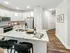 Open kitchen with a marble countertop at Abberly Commons Apartments in Charlotte, NC