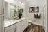 Bathroom with walk in shower and double vanity at Abberly Commons Apartments in Charlotte, NC