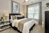 Bedroom with large window at Abberly Commons Apartments in Charlotte, NC