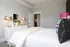 A spacious bedroom with large dresser at Abberly Onyx Apartments in Decatur, GA