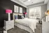 A bedroom with cozy bed and large window for natural light at Abberly Onyx Apartments in Decatur, GA