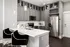 A kitchen with a white granite countertop and a stainless steel refrigerator at Abberly Onyx Apartments in Decatur, GA