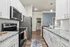 Kitchen with white cabinets and modern appliances at West Ashley Apartments in Charleston, SC