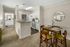 Kitchen with bar at Abberly Grove Apartments in Raleigh, NC