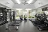 Gym with cardio and weight machines at Abberly Grove Apartments in Raleigh, NC