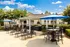 Poolside patio with grills at Abberly Grove Apartments in Raleigh, NC