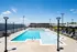 Rooftop Swimming Pool with Lounge Chairs at Abberly Skye Apartments in Decatur, GA