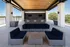 Patio with Bar Area and Cozy Couches at Abberly Skye Apartments in Decatur, GA