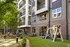 Open Courtyard with Swings and Lounge Charis at Abberly Skye Apartments in Decatur, GA