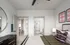 Spacious bedroom featuring a large bed and a ceiling fan at Abberly Foundry Apartments in Nashville, TN