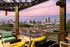 A breathtaking view of the Nashville Skyline rooftop deck at Abberly Foundry Apartment Homes in Nashville