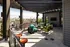 A rooftop patio featuring chairs and a table at Abberly Foundry Apartment Homes in Nashville, TN