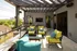 A charming patio featuring yellow and blue couches and chairs at Abberly Foundry Apartment Homes in Nashville, TN