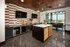 A modern room featuring a table and chairs with a television mounted on the wall at Abberly Foundry Apartment Homes in Nashville, Tennessee