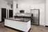 A kitchen with white cabinets, a large island, and modern appliances at Abberly Riverwalk Apartments in Nashville, TN