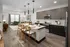 Contemporary kitchen featuring stainless steel appliances, elegant pendant lighting, and stylish wood plank flooring at Abberly Riverwalk Apartments in Nashville, TN