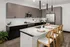 Contemporary kitchen featuring stainless steel appliances, elegant pendant lighting, and stylish wood plank flooring at Abberly Riverwalk Apartments in Nashville, TN