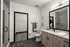 A bathroom with white walls, black tiled floors, and a spacious walk-in closet at Abberly Riverwalk Apartments in Nashville, TN