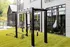 Outdoor fitness equipment with a large garage door and TRX straps at Abberly Riverwalk Apartments in Nashville, TN