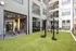 Outdoor fitness equipment with a large garage door and TRX straps at Abberly Riverwalk Apartments in Nashville, TN