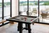 A pool table in the clubhouse with modern amenities at Abberly Riverwalk Apartments in Nashville, TN