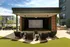 An outdoor movie area with comfortable seating and modern amenities at Abberly Riverwalk Apartments in Nashville, TN