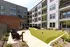 A putting green with lush surroundings and modern amenities at Abberly Riverwalk Apartments in Nashville, TN