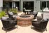 An outdoor patio with a firepit, wicker chairs, and modern outdoor amenities at Abberly Riverwalk Apartments in Nashville, TN