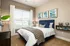Beautiful Bright Bedroom with Wide Window at Abberly Solaire Apartments in Garner, NC