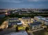Aerial View of Buildings and River with City at Abberly Riverwalk Apartments in Nashville, TN