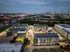 Aerial View of Buildings and River with City at Abberly Riverwalk Apartments in Nashville, TN