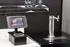 Innovative tap system with sleek tablet interface for easy selection, featuring modern dual lever beer dispenser.