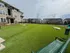 Beautiful apartment complex featuring lush green spaces and modern multi-story buildings, perfect for relaxed living.