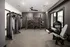 Modern fitness center equipped with versatile gym machines, sleek design, and ample workout space.