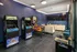 Modern entertainment room featuring classic arcade games, stylish seating, and a sleek design.