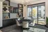 Elegant dining area with modern black cabinetry, artistic decor, and stylish chandelier, featuring large windows overlooking a sunny courtyard.