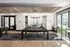 Chic recreational space with a modern pool table, elegant lighting, and expansive windows offering bright natural light.