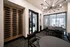 Modern interior with sleek wine display and elegant chandelier, perfect for sophisticated gatherings.