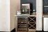 Elegant wine station in a modern kitchen setup featuring a sleek wine dispenser, wine cooler, and stylish storage compartments.